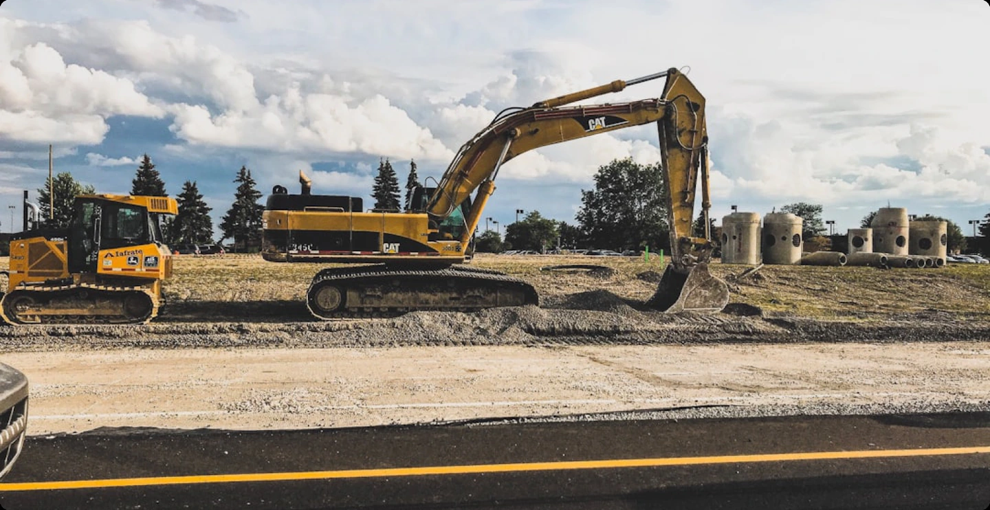 Excavators grading a prepared site